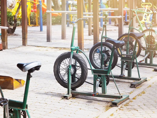 Row of metal outdoor exercise bikes. — Stock Photo, Image
