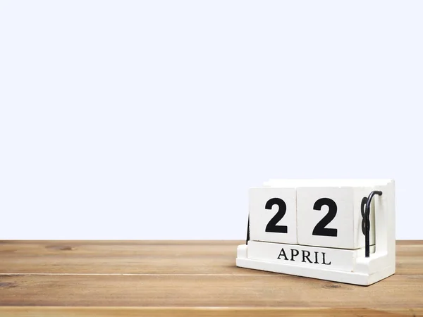 Wood block calendar on brown wooden table — Stock Photo, Image