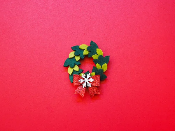 Christmas handmade wreat ornament on red background. — ストック写真
