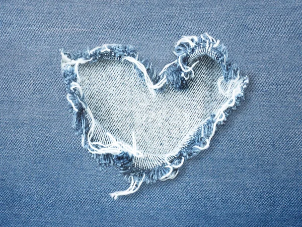 Heart shape ripped jean denim texture — Stock Photo, Image