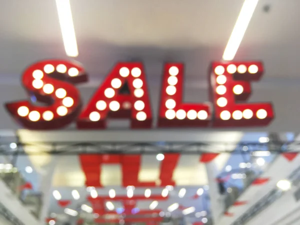 Alışveriş Merkezindeki Kırmızı Ifadeli Ampul Satışının Soyut Bulanık Arkaplanı — Stok fotoğraf