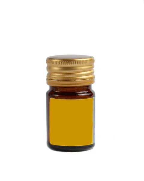 Brown glass pill jar with yellow label — Stock Photo, Image