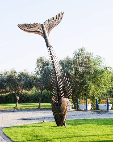 sculpture of a fish skeleton at the entrance to an open-air fish restaurant in Turkey in the Rixos hotel chain
