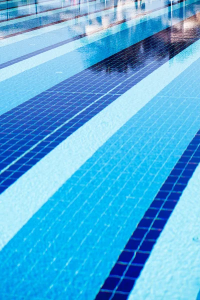 Outdoor large blue swimming pool on site close-up.