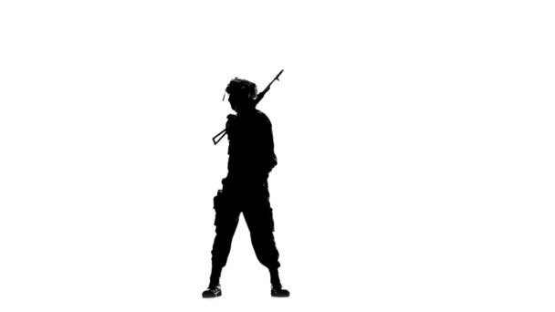 Soldier with a gun on his back. Silhouette — Αρχείο Βίντεο