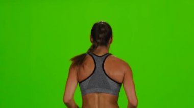 Kadın koşu. Arkadan Görünüm. Yeşil ekran