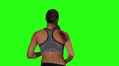Kadın koşu. Arkadan Görünüm. Yeşil ekran. Ağır çekim