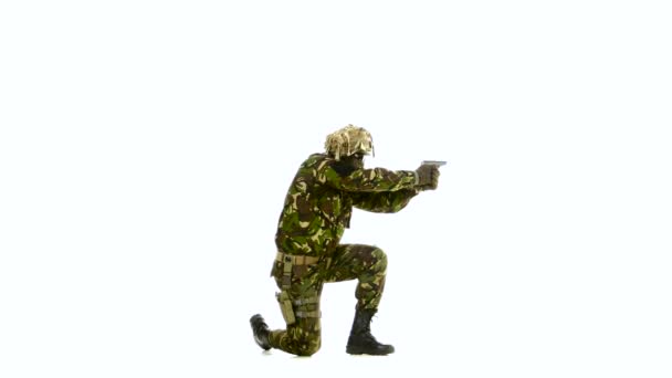 Armed man stands on one knee. White backgraund — Stock video