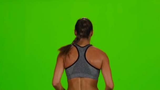 Frau joggt. Rückseite. Green Screen — Stockvideo