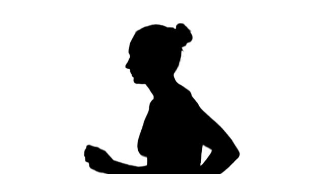 Girl with athletic body running. Side view. Silhouette. White — Stock video