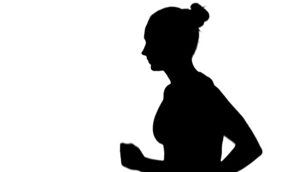 Girl with athletic body running. Side view. Silhouette. White. Slow motion — Αρχείο Βίντεο