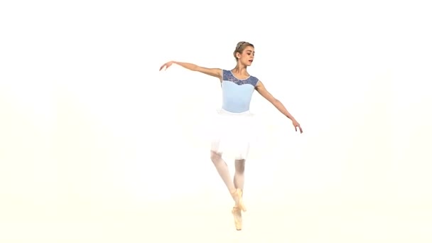 Graceful ballerina in ballet pose on white, slow motion — Stock Video