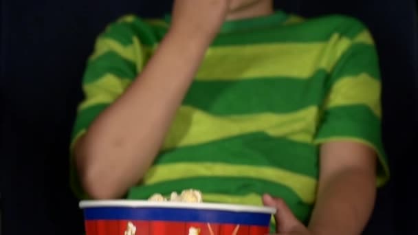 Smiling little boy watching movie in a cinema, 3D glasses, close up. Slow motion — Stock video