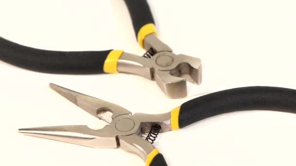 Wire cutters and mini cutters on white, rotation, close up — Stock Video