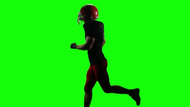 Football player running with the ball for the winning player. Green screen — Stock Video