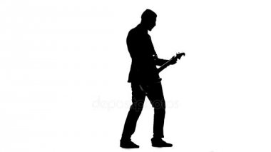 Müzisyen dizeleri elektro gitar koparmak. Siluet