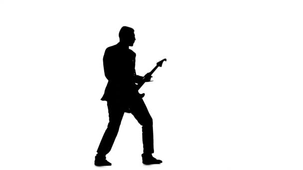 Silhouette des Gitarristen spielenden Betrachters. E-Bass-Gitarre — Stockvideo