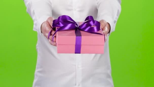 Man holding out a box with a gift. Close up — Stock Video