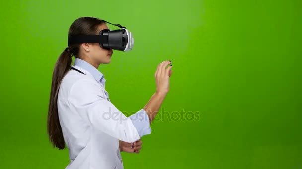 Woman doctor browses the files using the virtual reality glasses — Stock Video