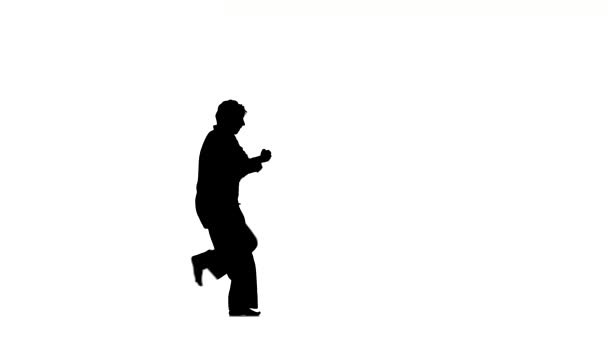 Ein Karate oder Taekwondo im schwarzen Kimono auf weißem Hintergrund, Silhouette — Stockvideo