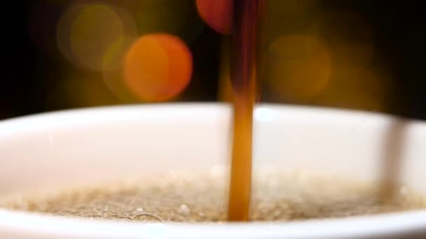 Closeup. Pouring jet of black coffee in a cup — Stock Video