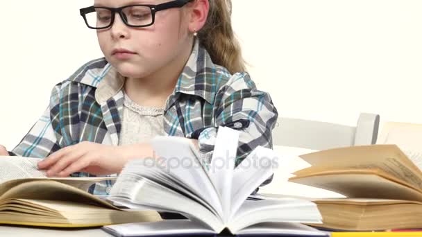 Girl is looking for information and records it. White background. Close up — Stock Video