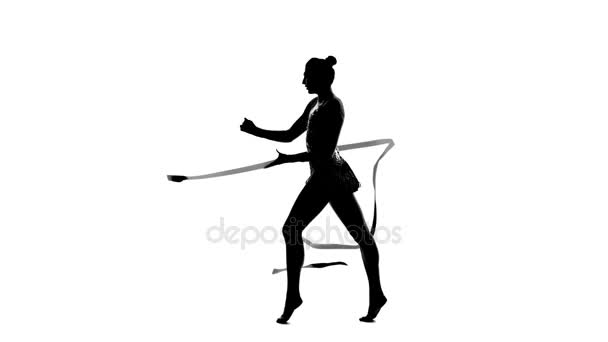 Girl gymnast with ribbon in hand revolve around him. Silhouette. White background — Stock Footage Girl gymnast with ribbon in hand revolve around him. Silhouette. White background Stock Footage