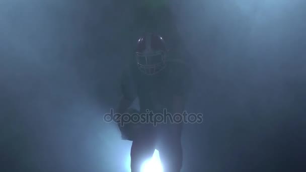 Rugby player running in the protective form through the smoke — Stock Video