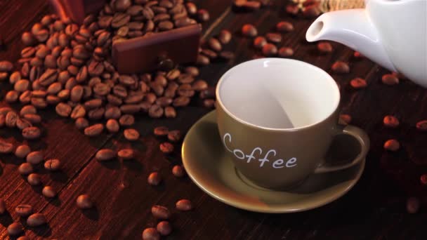 Espresso in small cup on a saucer on wooden table — Stock Video