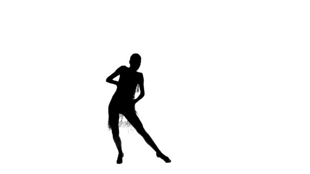 Solo girl is dancing elements of ballroom dancing. Silhueta, estúdio — Vídeo de Stock