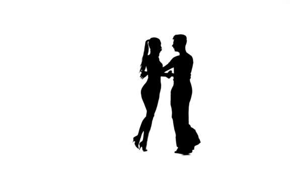 Dance element from rumba, silhouette couple. White background, slow motion — Stock Video