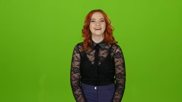 Redhaired girl smiles, laughs, is happy and cheerful. Green screen — Stock Video