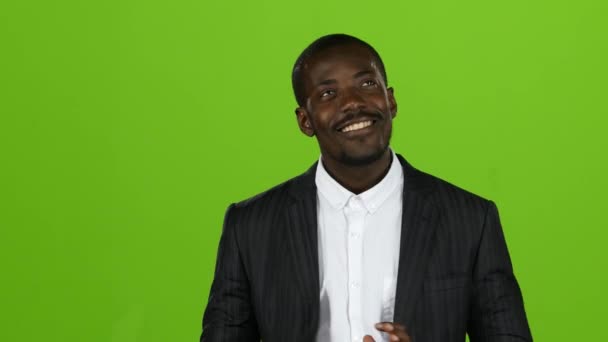 African american shows thumbs up, he likes everything, hes on the positive. Green screen — Stock Video