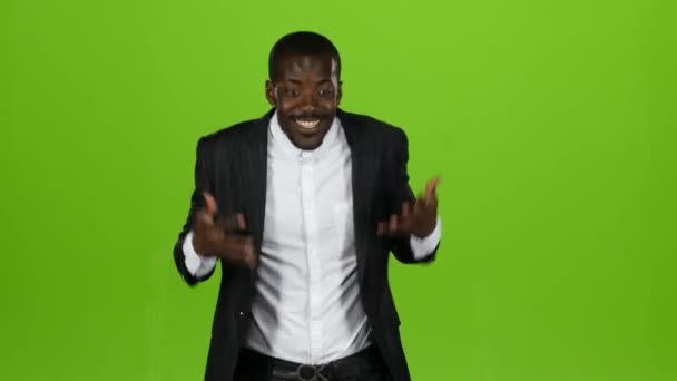 Guy in the strict black suit is happy with his victory. Green Screen — Stock Video