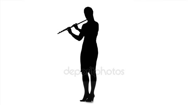 Girl playing on flute. Silhouette on white background, slow motion — Stock Video