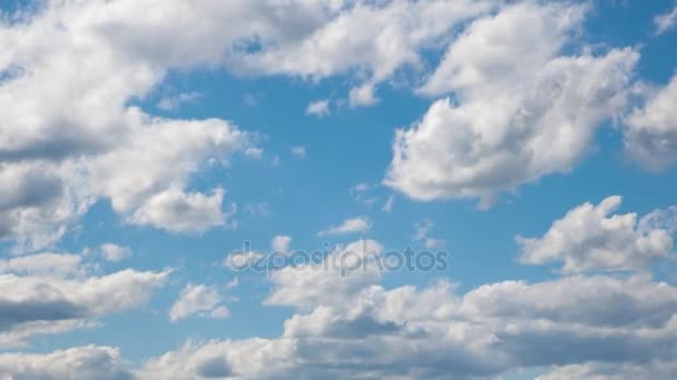 White clouds are formed in the blue sky. Time lapse — Stock Video