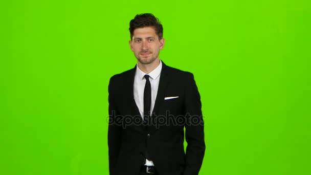 Man is going to a business meeting and waving greetings. Green screen — Stock Video