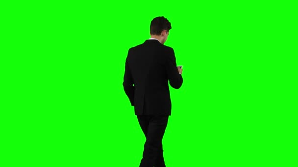 Businessman is going to work and prints important messages. Green screen — Stock Video