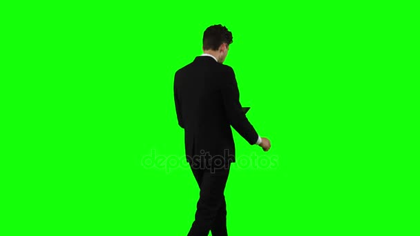 Businessman is going to work and prints important messages. Green screen — Stock Video