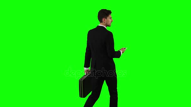 Businessman is a diplomat, a telephone rings to him and he talks. Green screen — Stock Video