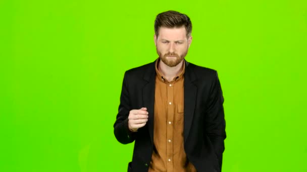 Man is suffering, his head hurts, he is tired. Green screen — Stock Video