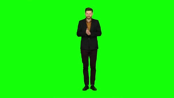 Young guy is happy with his victories, he is happy. Green screen — Stock Video