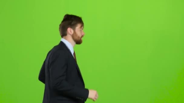 男は実行するために、重要な会議に遅刻です。緑色の画面 — ストック動画