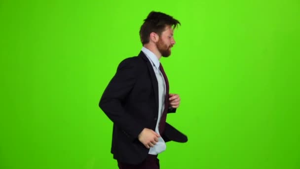 Man runs to work, is late for an important meeting. Green Screen. Slow motion — Stock Video