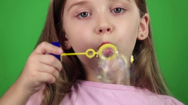 Baby lets the soap bubbles. Green screen. Slow motion. Close up — Stock Video