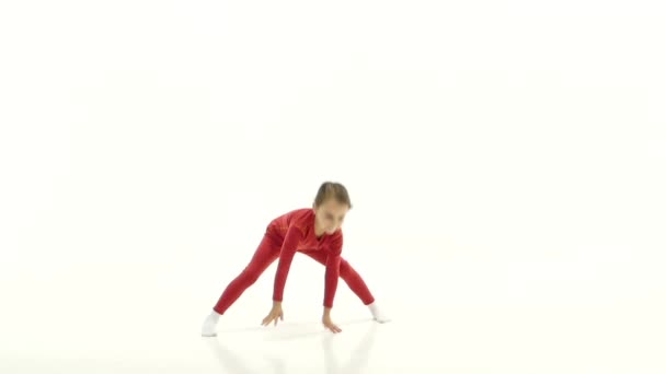 Children is sitting on the twine and showing a thumbs up. White background. Slow motion — Stock Video