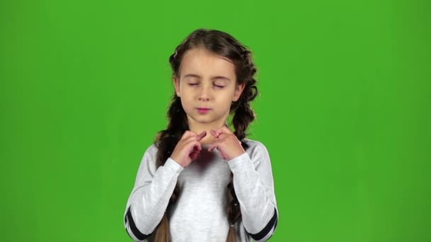 Baby crosses his fingers in his arms. Green screen. Slow motion — Stock Video