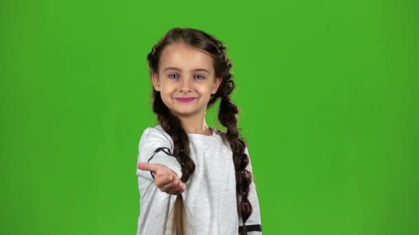 Baby girl shows thumbs up. Green screen. Slow motion — Stock Video