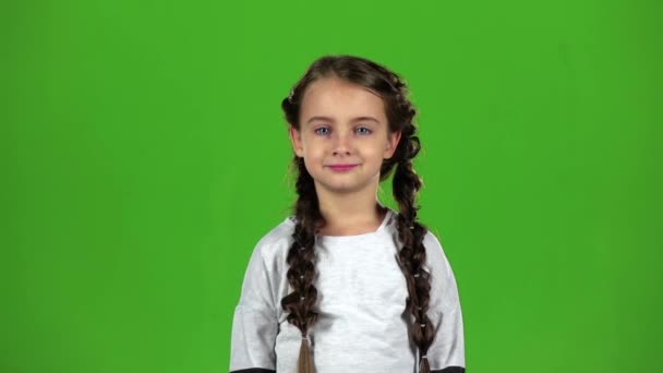 Baby is making grimaces. Green screen. Slow motion — Stock Video