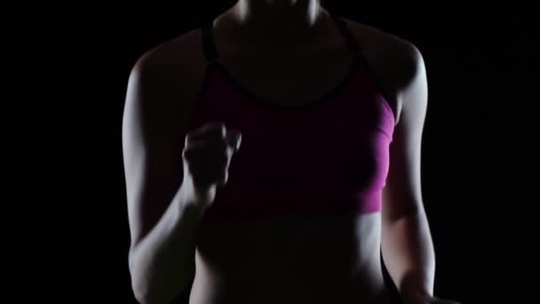 Sports running athlete on a black screen. Slow motion. Close up — Stock Video
